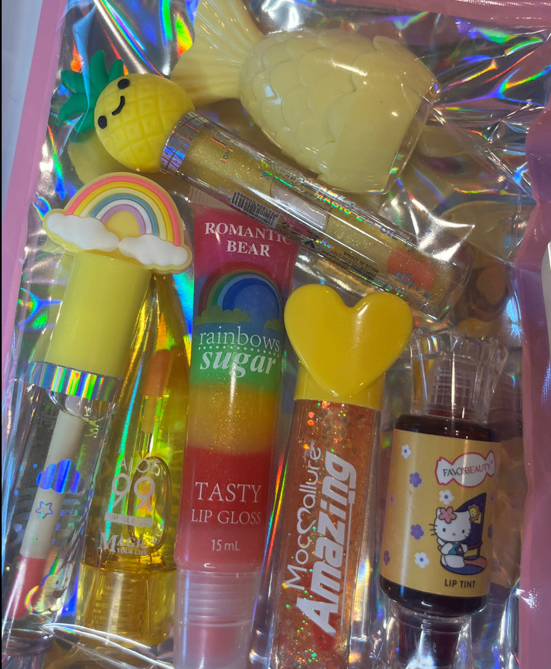 Yellow rainbow lip oil, rainbow sugar lip gloss, aloe lip oil, yellow hello kitty glitter gloss, hello kitty red tint, mermaid lip balm