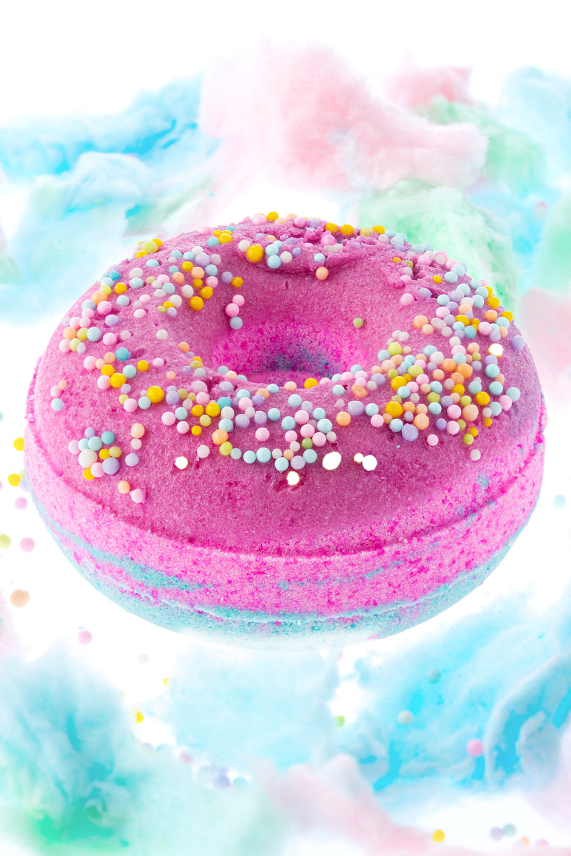 Cotton Candy Donut Bath Bomb is a deep pink and turquoise blue with matching sprinkles for bath soak rituals