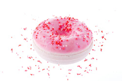 Juicy Donut Bath Bomb Fizz with skin safe colorants in a beautiful soft pink  with red, pink, and white sprinkles