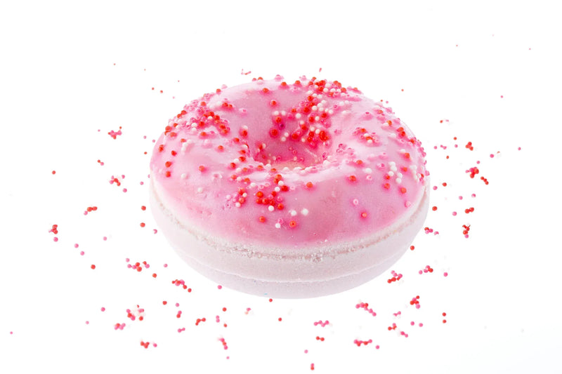 Juicy Donut Bath Bomb Fizz with skin safe colorants in a beautiful soft pink  with red, pink, and white sprinkles