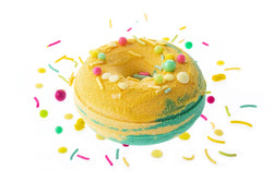 Bright yellow sweet pineapple scented bath bomb with sprinkles and confetti for a luxury bath soak